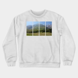 A static shot from the surroundings of Castaldia di Piancavallo with alps in background and a little mist. Beautiful nature in a spring sunny day; no people around Crewneck Sweatshirt